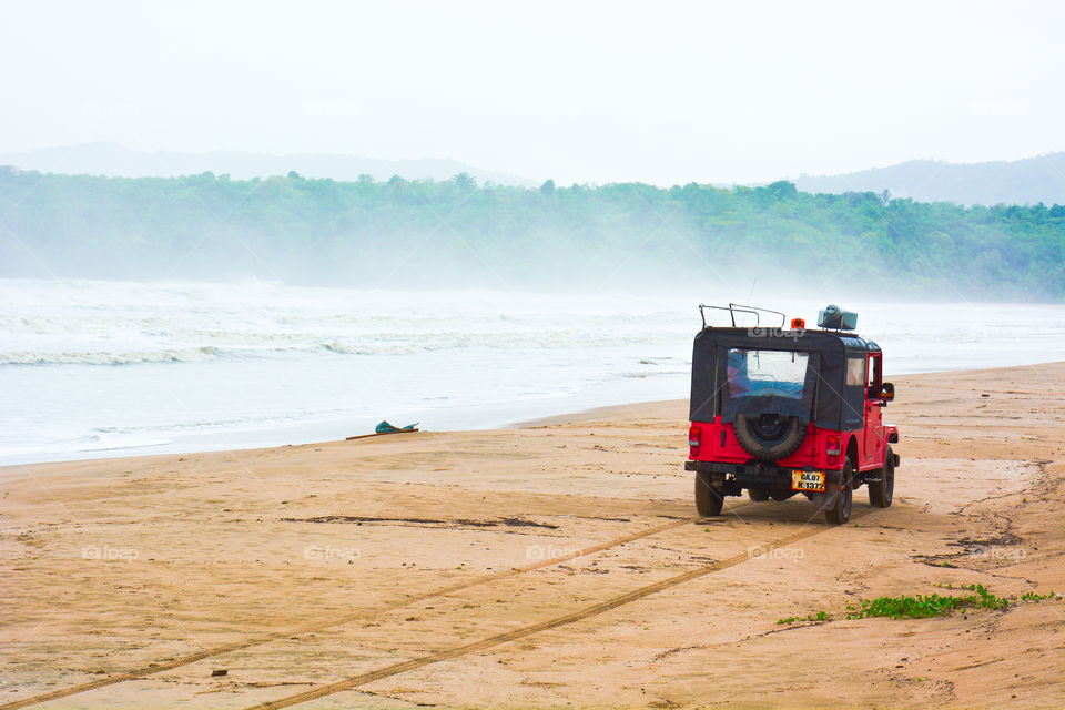 Beach patrol car. A picture i took at a beach in south goa where a patrol car was patrolling for safety . 