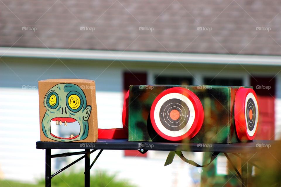 Shooting targets at a Nerf party. 