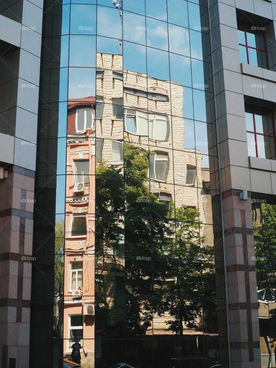 incredible reflection in the window of the building