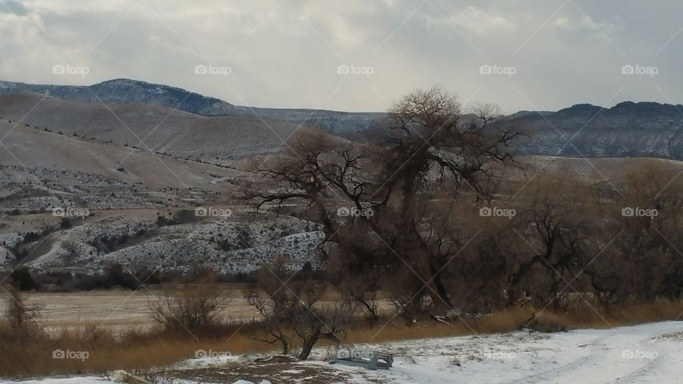 light dusting of snow on the field and hills