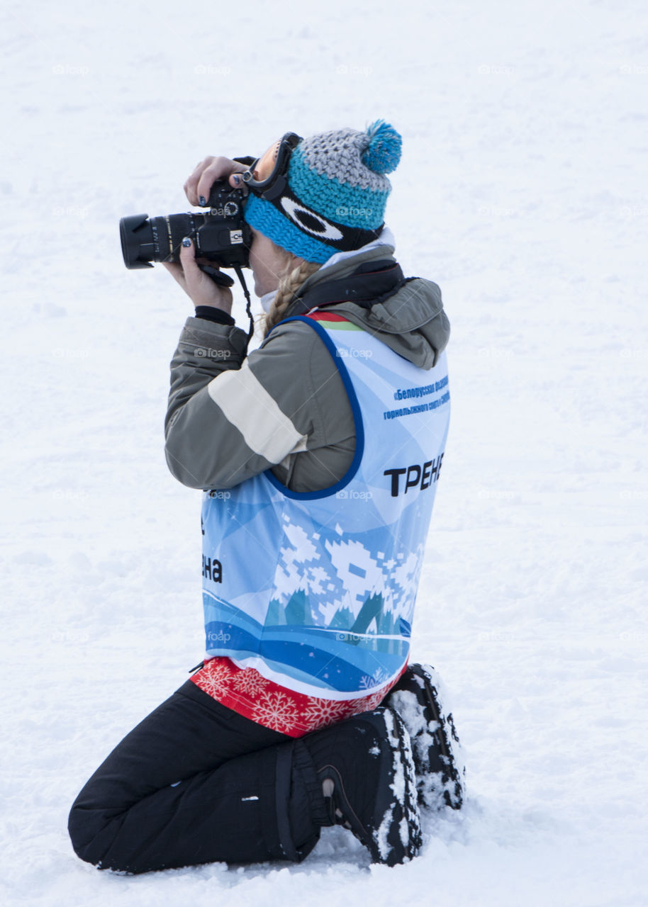 photographer taking pictures in the snow in the winter