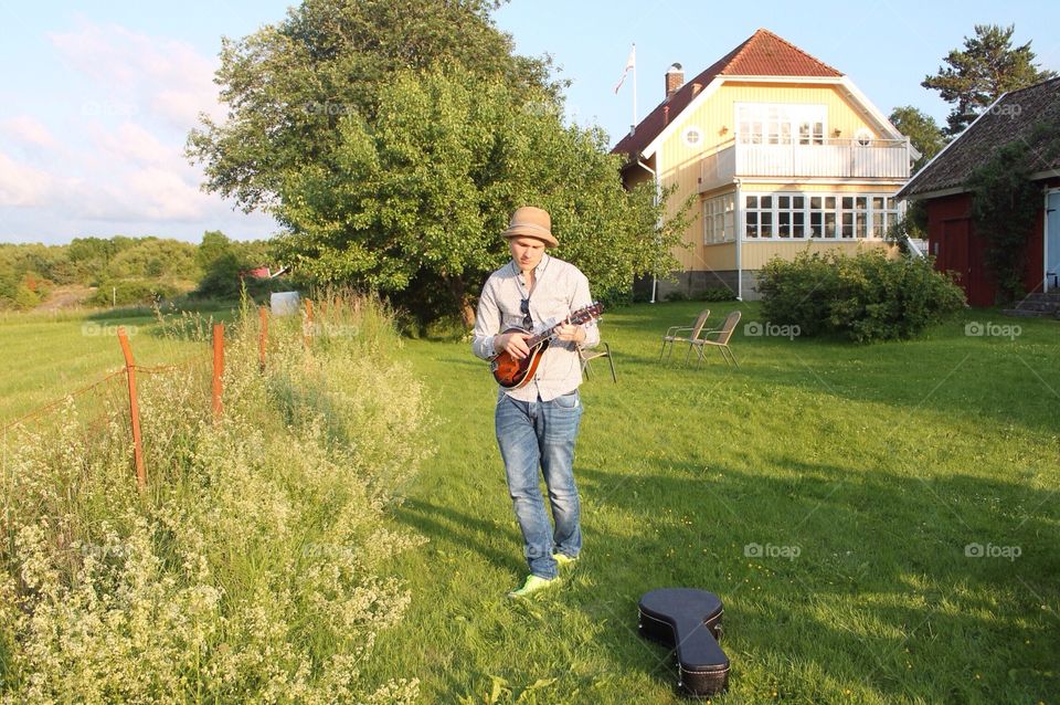 Playing mandolin at a summer party 