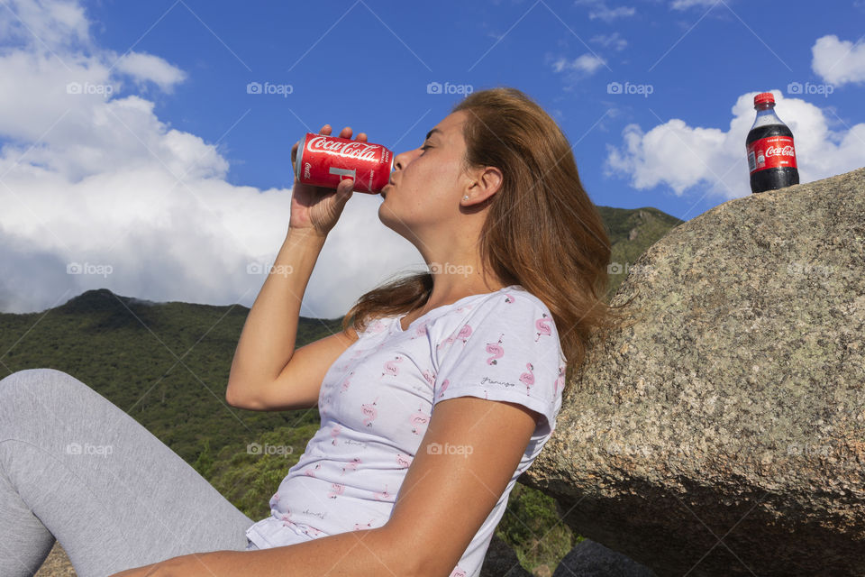 Drinking Coca Cola on the mountain.