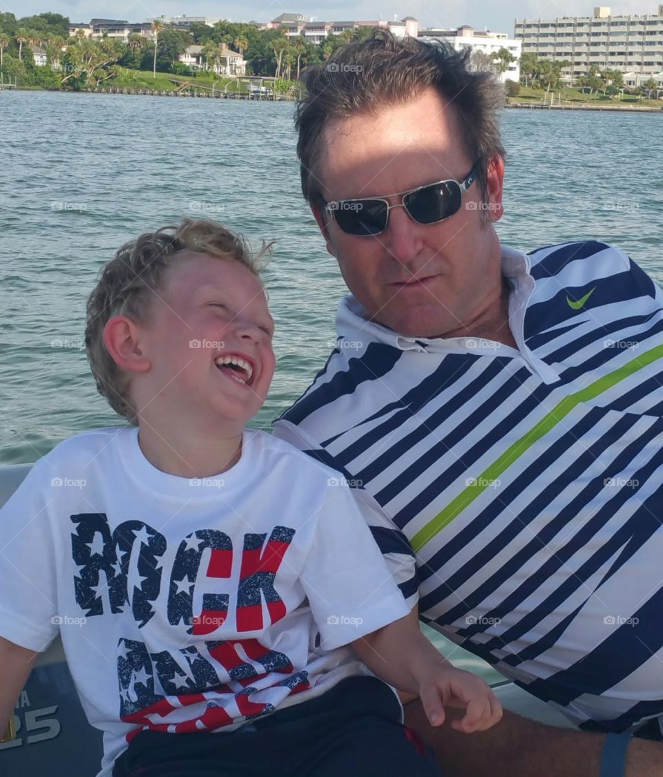Dylan & Daddy. family boating day and captured a priceless moment between father and son
