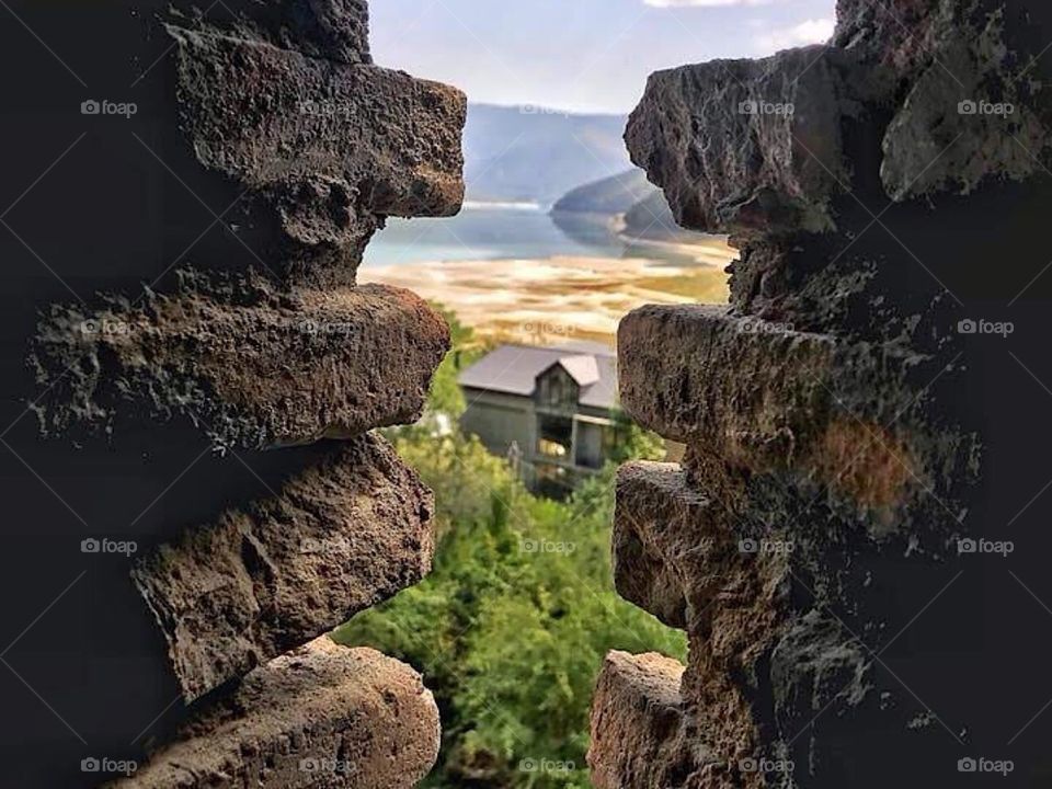 A house beneath the wall