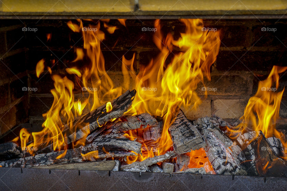 yellow fire in the fireplace