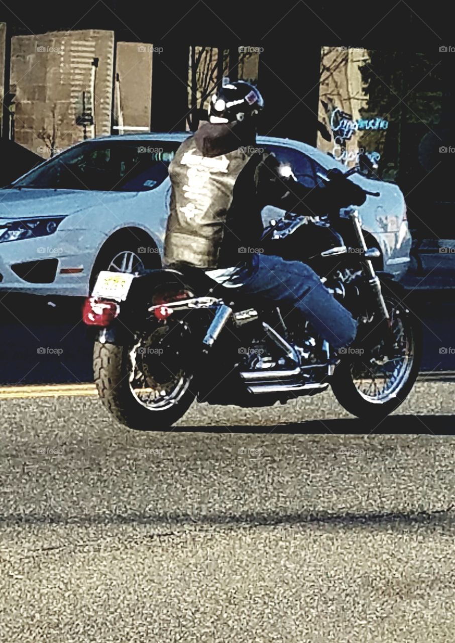motorcycle rider out driving in downtown