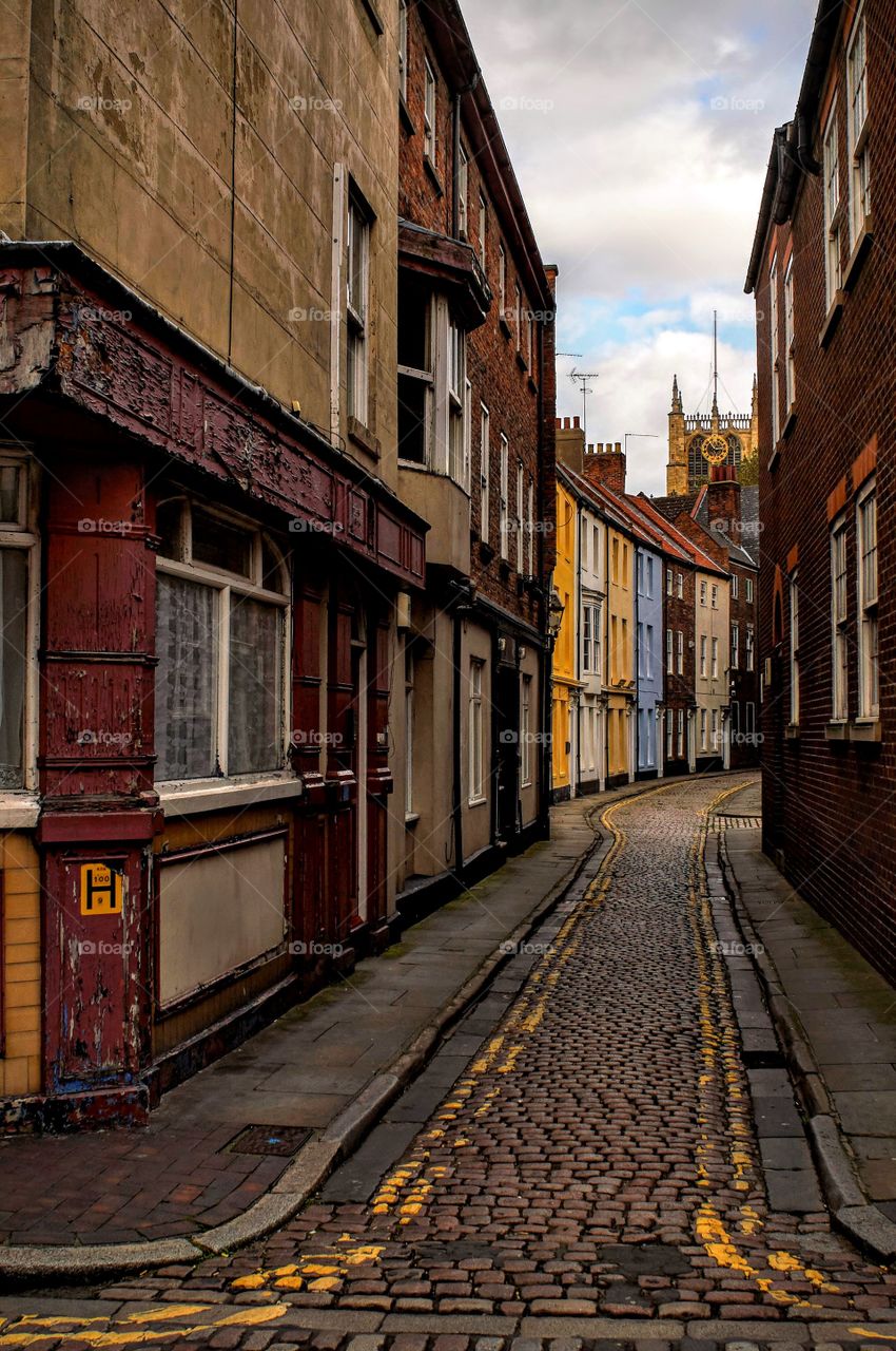 View of cobblestone road and buildings outdoors