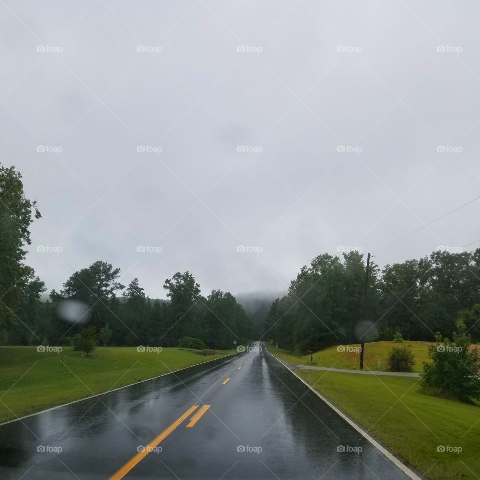 gloomy but beautiful day. overcast in the mountains. rain, road. travel, and country. somewhere in beautiful Alabama
