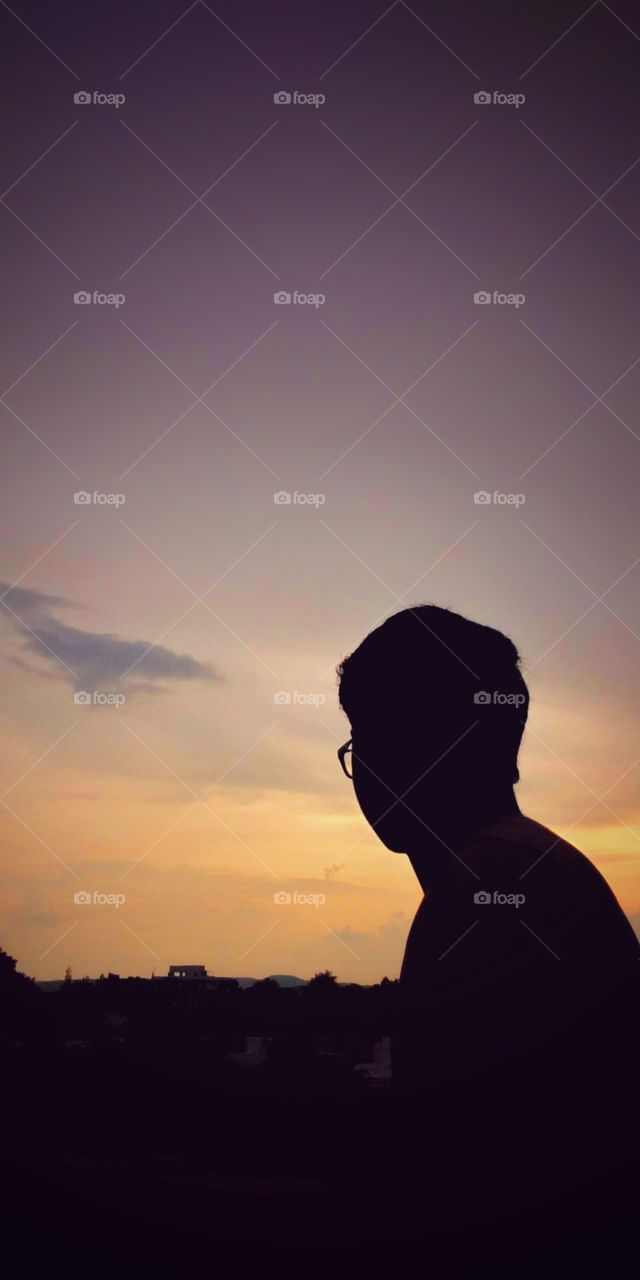 shadow of a boy standing alone