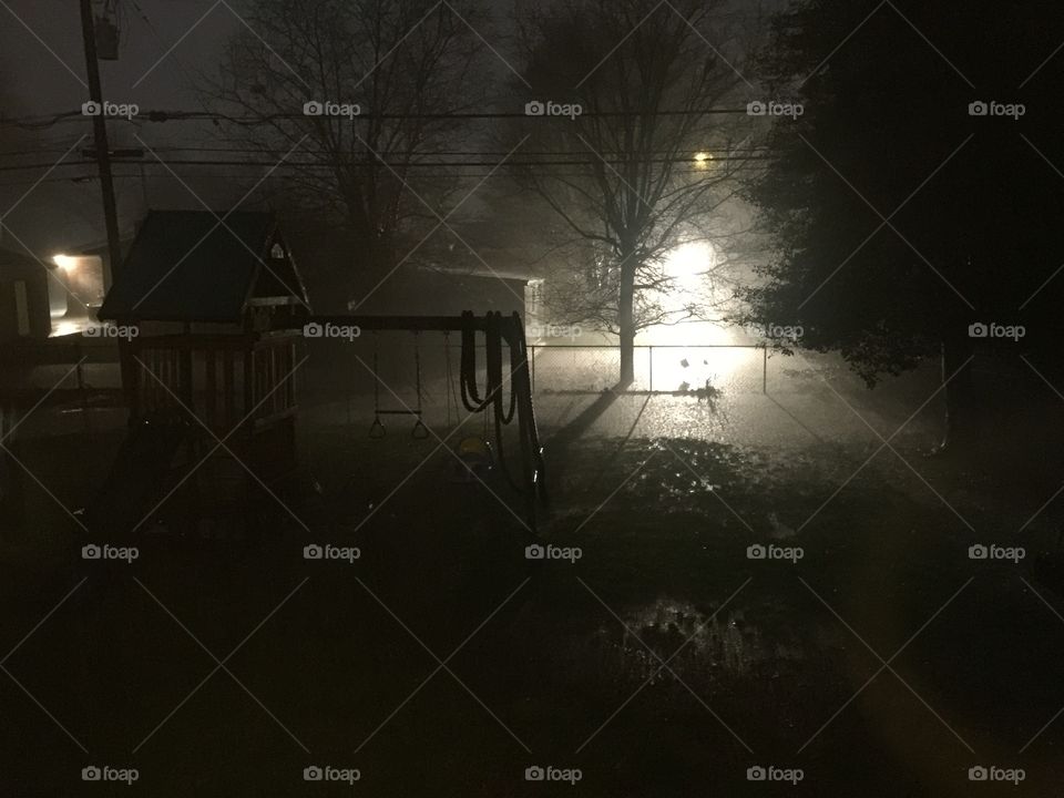 Dark and stormy night of a kid’s backyard flooding.