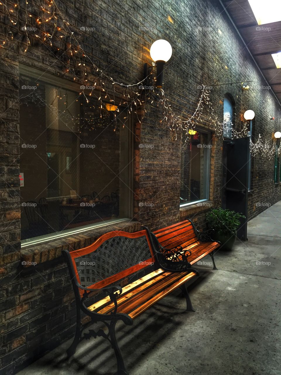 Cozy alley-way bench in the middle of downtown 