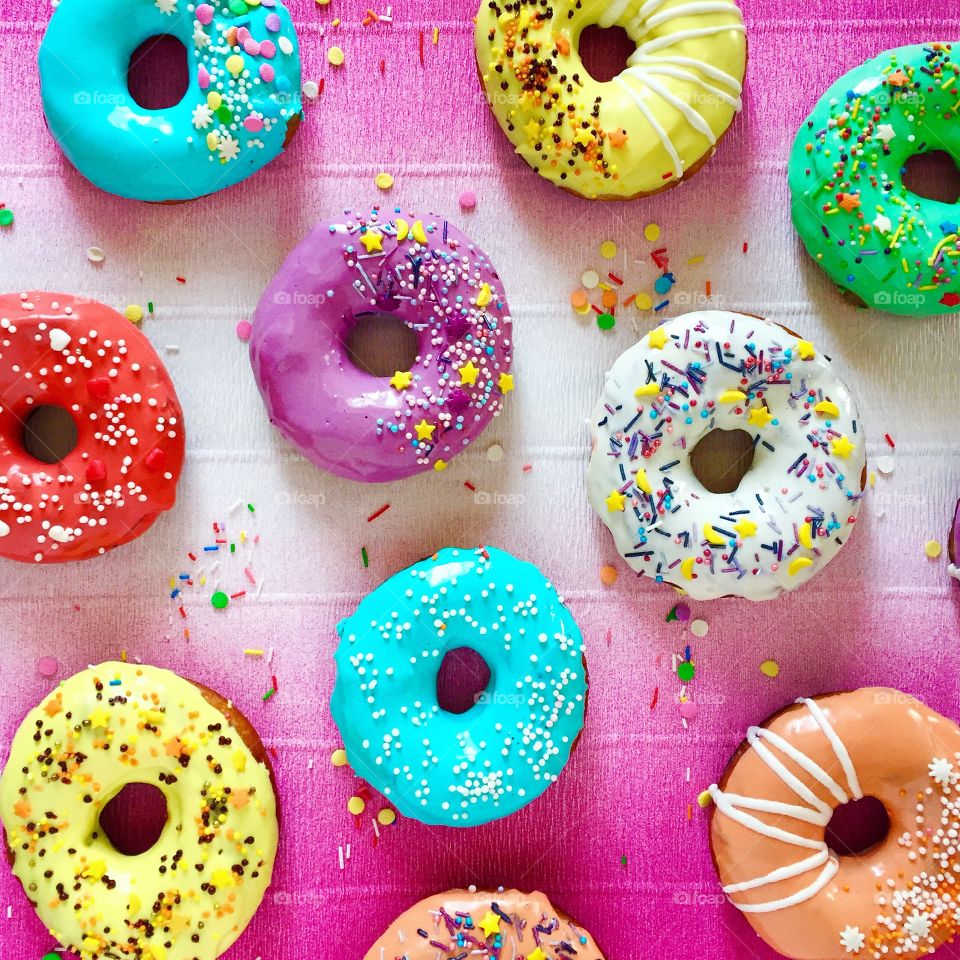 Delicious donuts on purple background