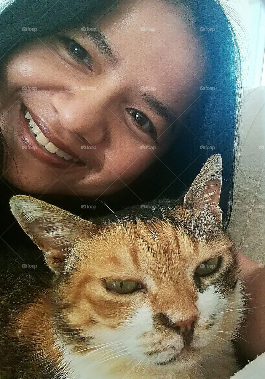 Lady and cat selfie. Love between human and cat.