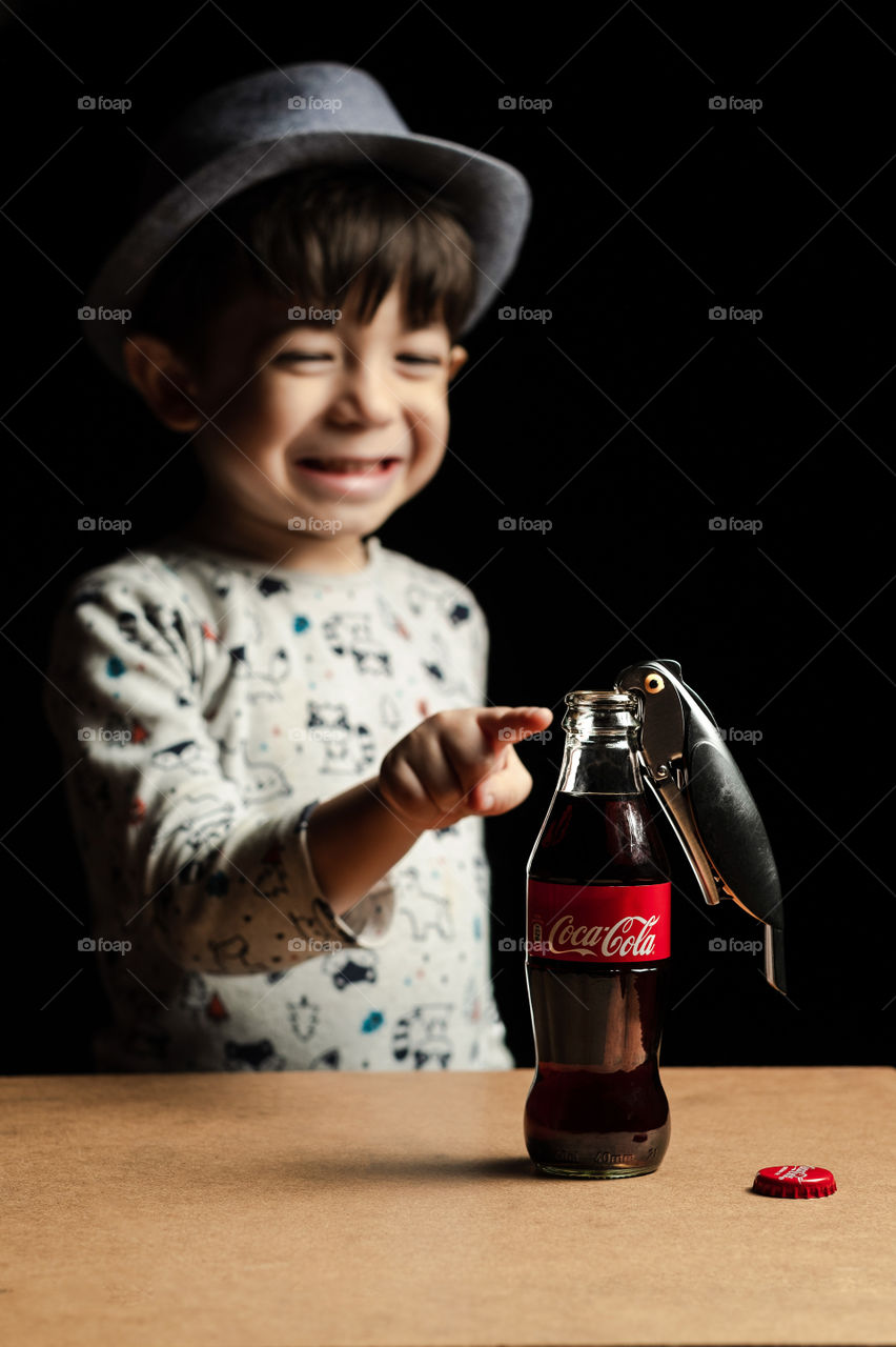 Boy enjoying the Coca Cola bottle