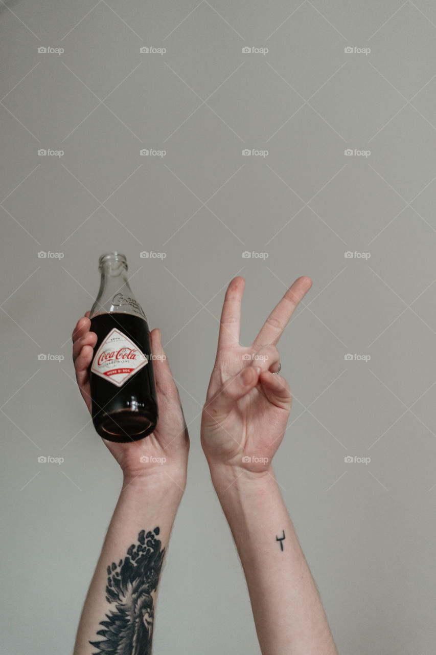 hands and coca cola 