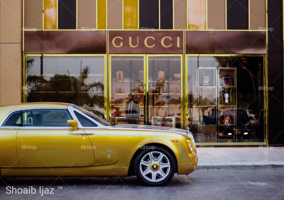 Rolls Royce Phantom Drophead Coupe DHCRRRolls infront of GUCCI.
Luxury life.
Arab style luxurious lifestyle. 
Gold theme.
