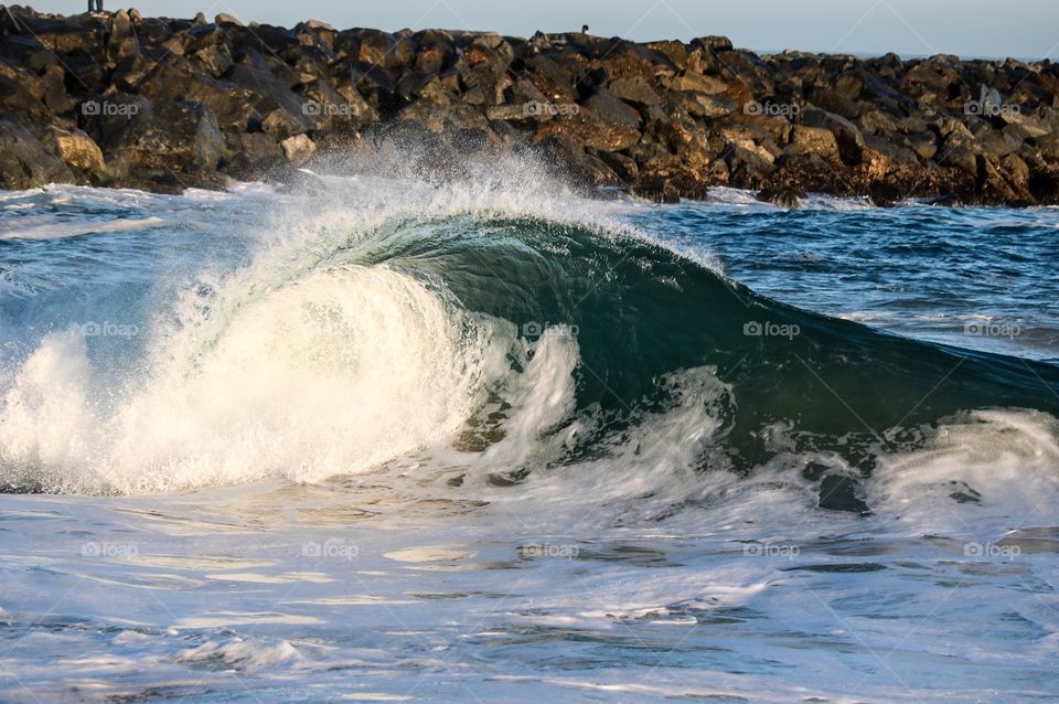 Waves crashing in sea