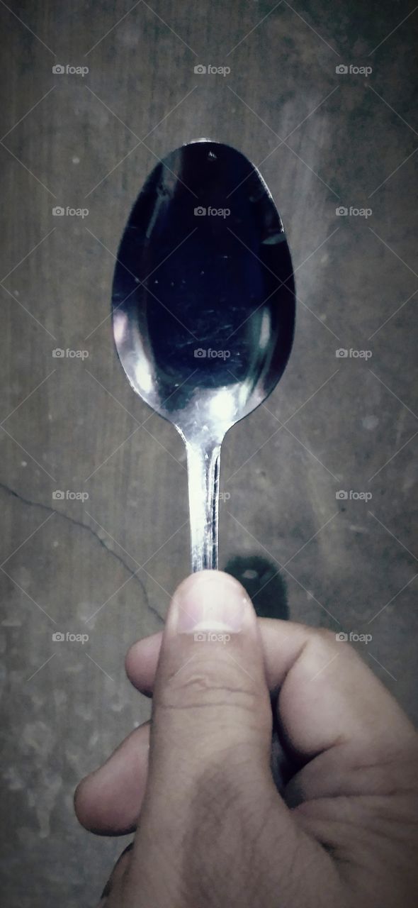 spoon and human hand