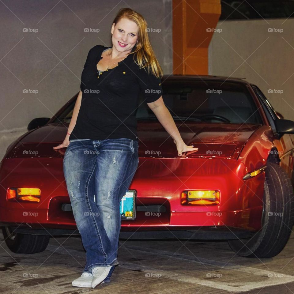 Girl modeling on car