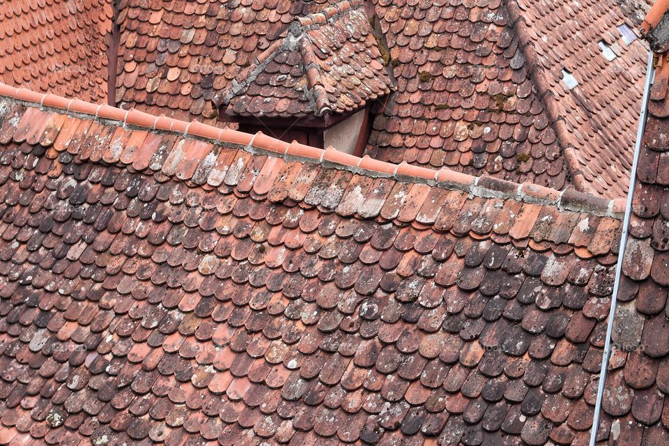 Close up of a red-tiled roof in a city