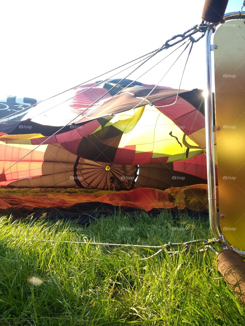 Inflating a colorful hot air balloon