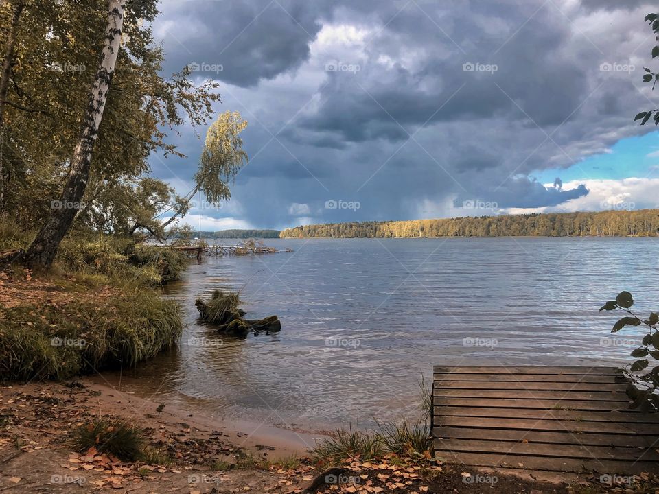 Autumn gloomy weather on the lake