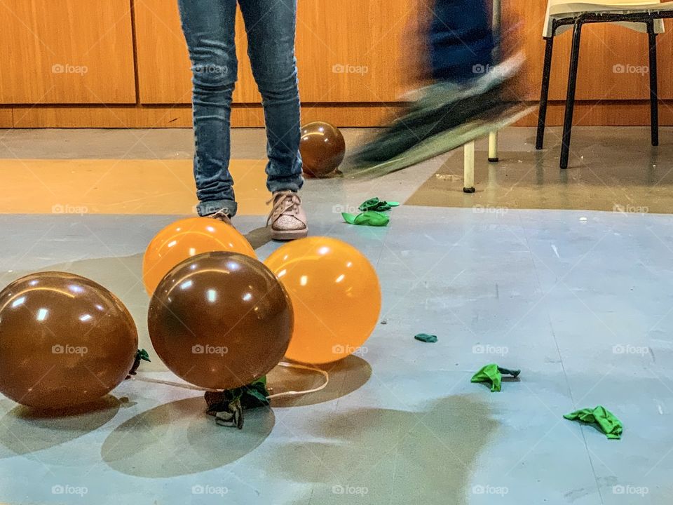 Children playing pop balloon