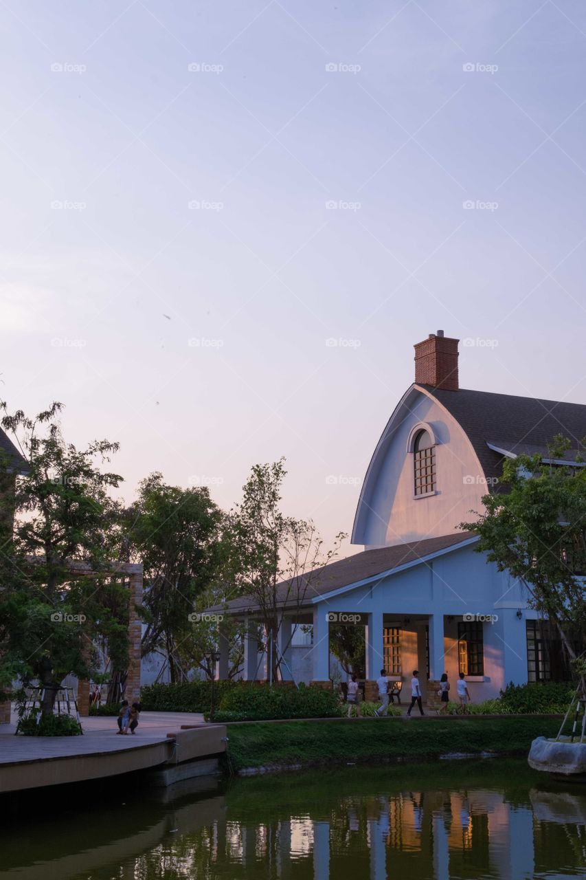 Arch roof house at warm violet sunset