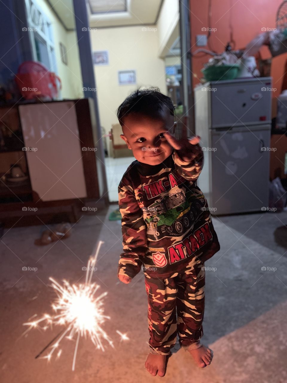 He look so hapy with the lil fire work