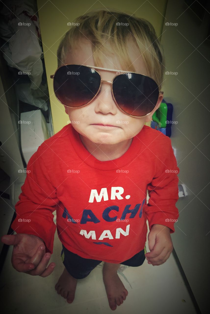 Close-up of a boy wearing sunglasses