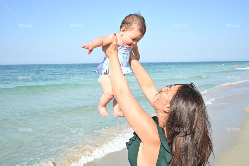 mom and daughter at the sea