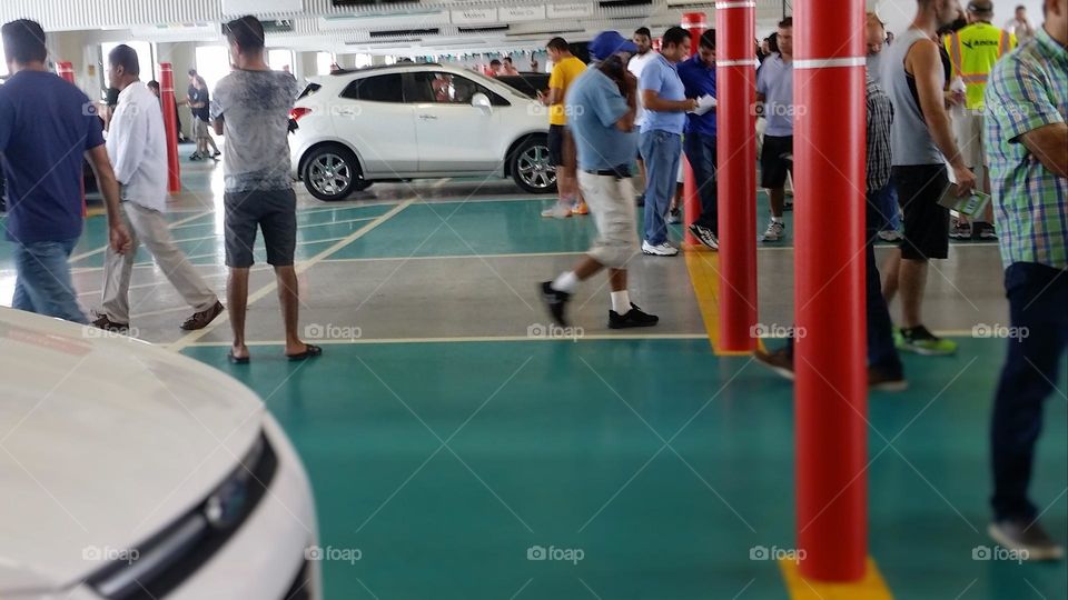 Crowd at a Car Auction