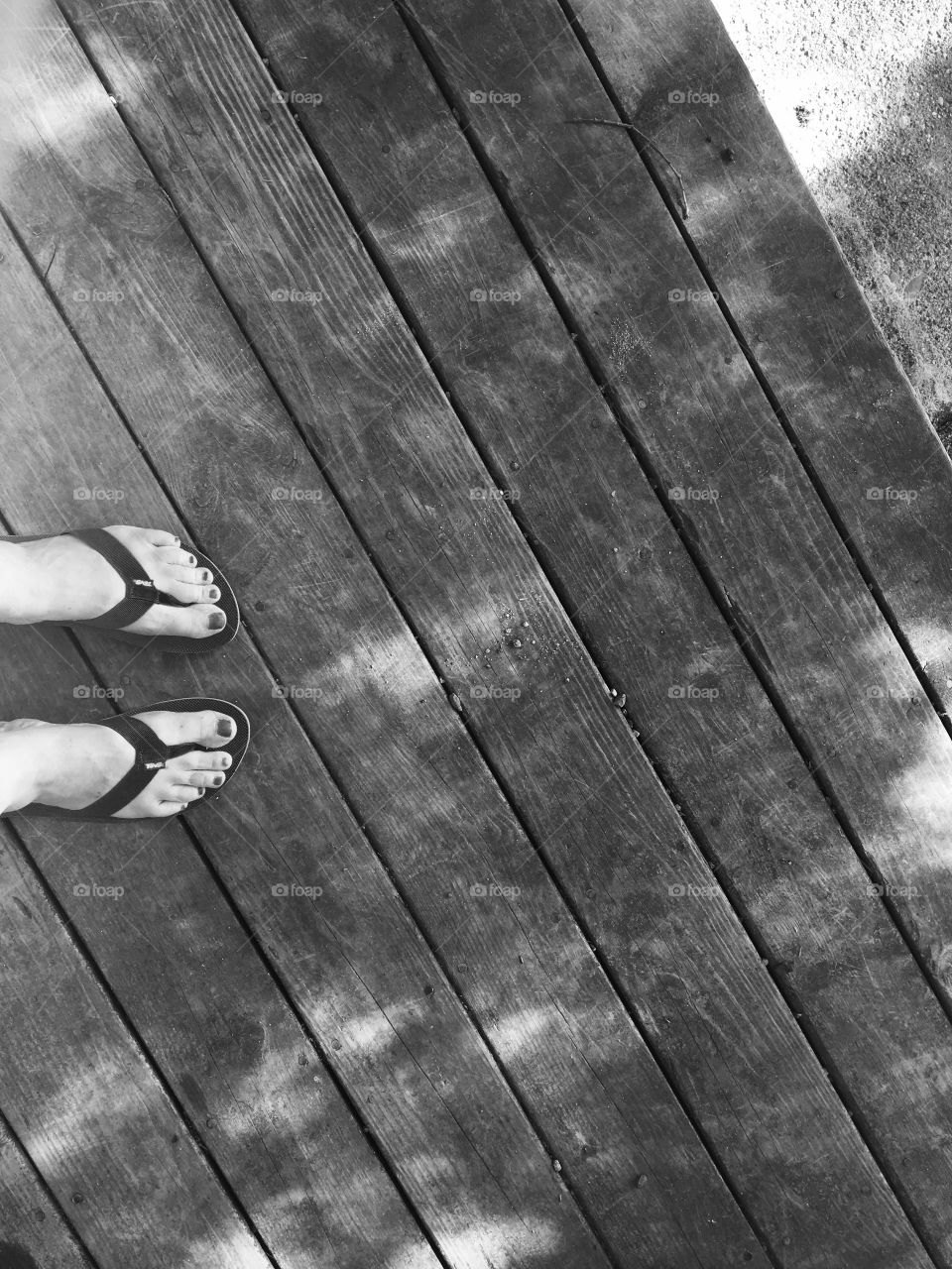 Looking down at my next home improvement project... Sanding and re-staining the deck.
