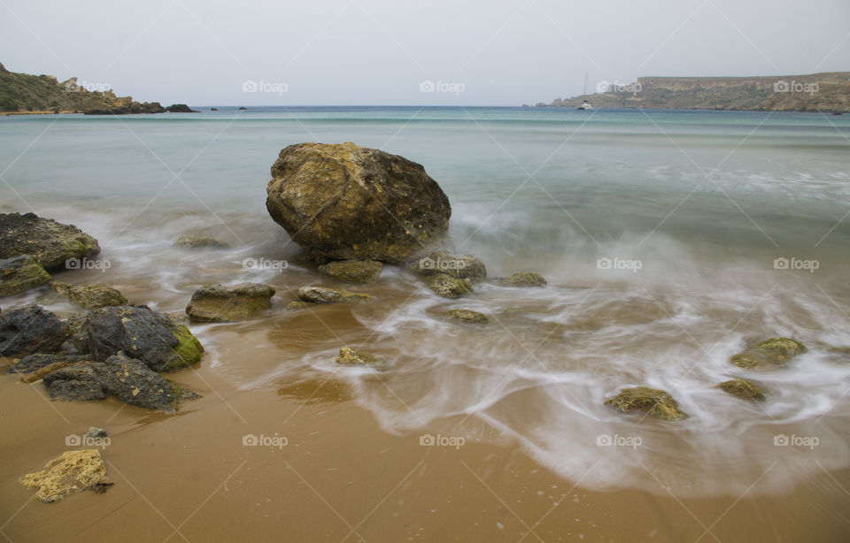 tranquil beach landscape at sunset in malta