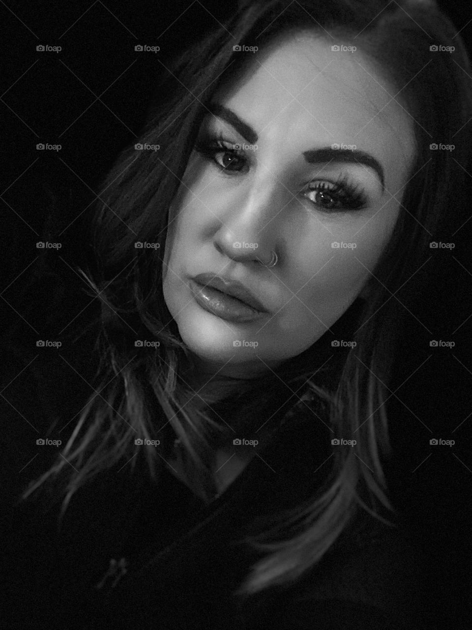 Portrait of a woman’s face in black and white taking with a mobile device 