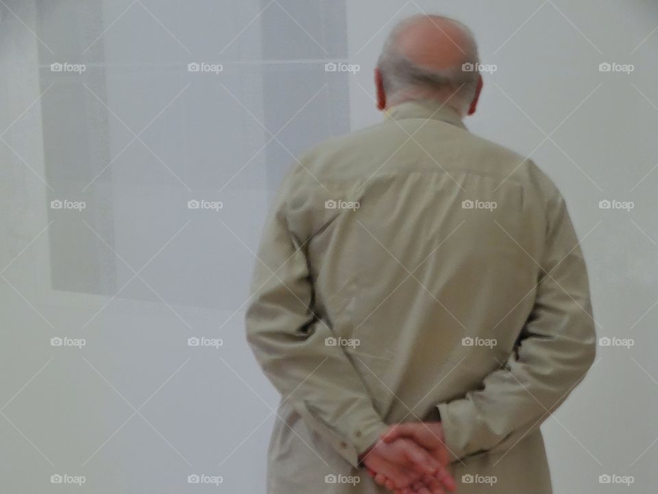 Elderly Man Looking At A Blank Wall