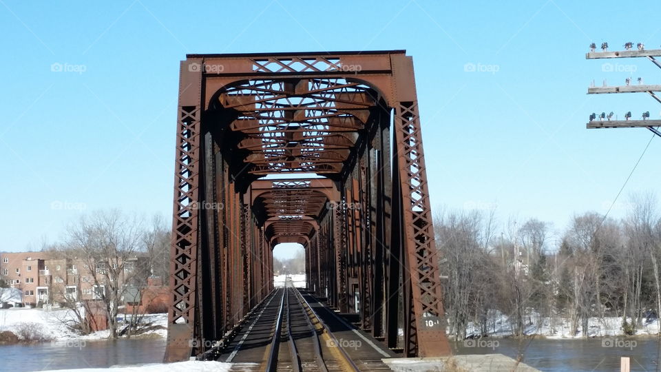 old rusty  train track structure river winter