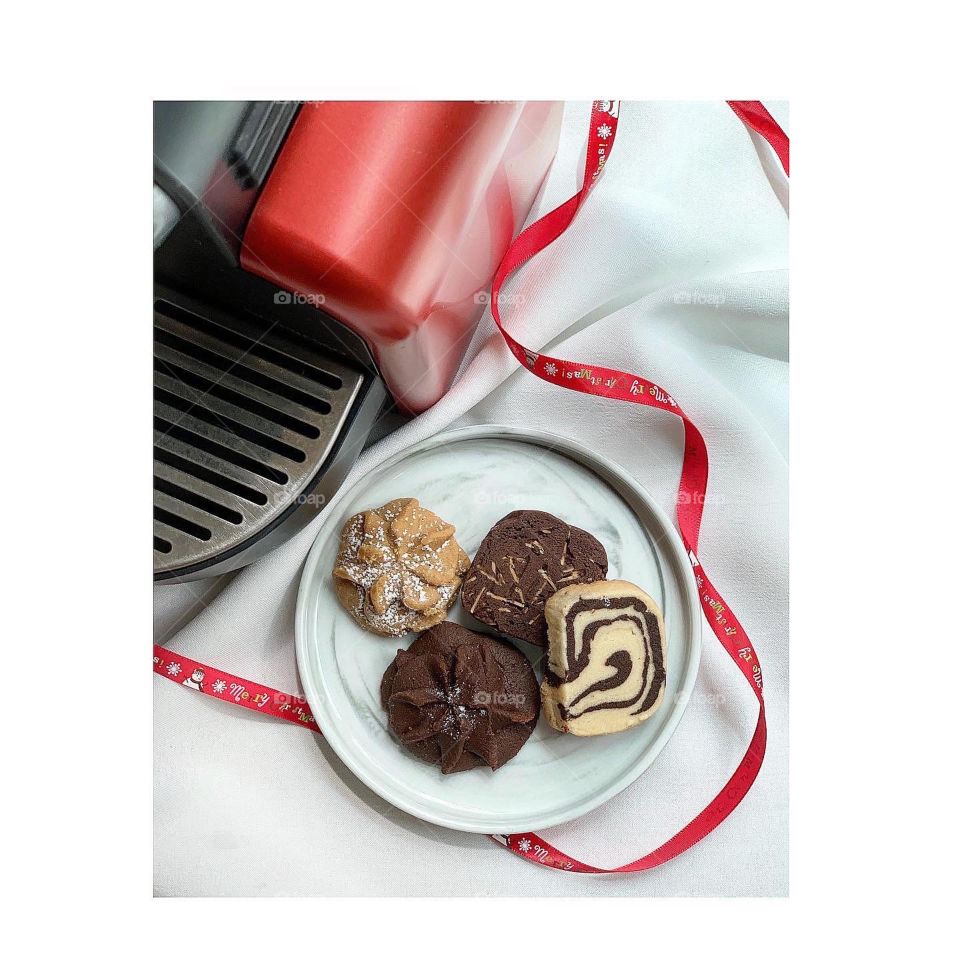 Chocolate nuts coffee caramel cookies with red coffee machine setting merry Christmas beautiful 