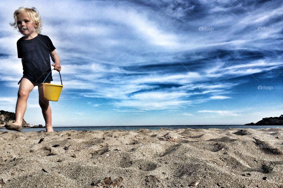 Boy playing on a beach
