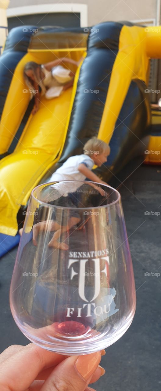 Wine tasting and kids playing