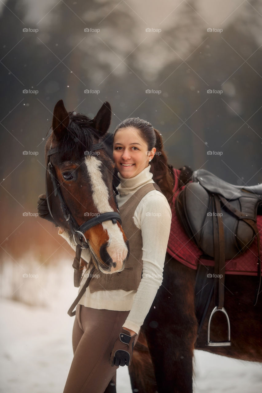 Young beautiful woman with horse outdoor portrait at spring day