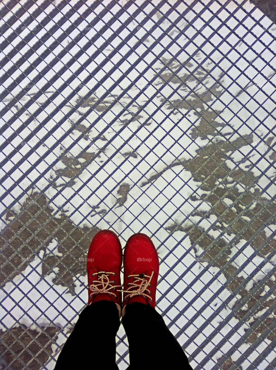 walking on a suspension bridge 500m above ground in Switzerland as the snow melts underneath