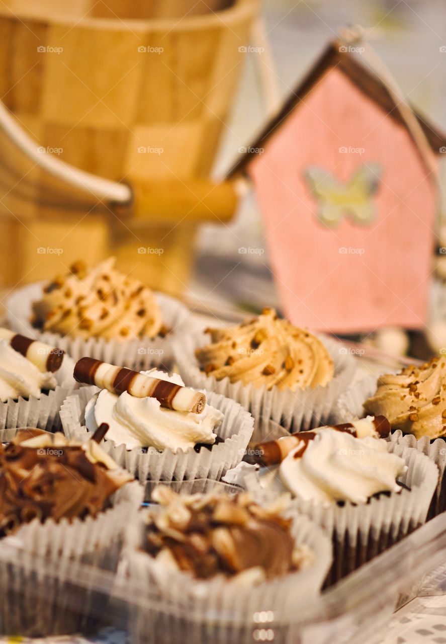 Table full of colorful cupcakes