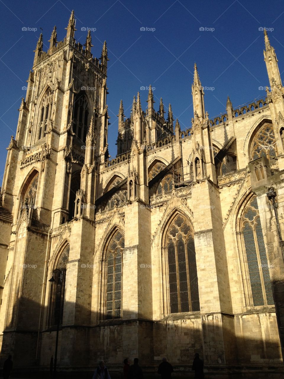 York Minster on a hot sunny day in June - blue skies. Huge building, can’t fit it all in the frame. 