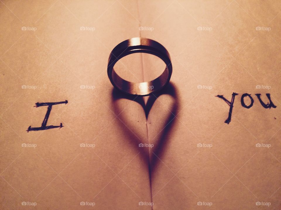 Ring with love text on book