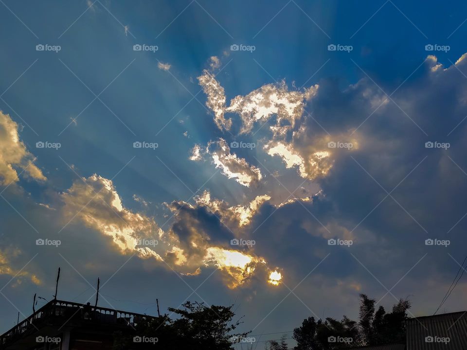 A dramatic mood created by the sunlight and clouds