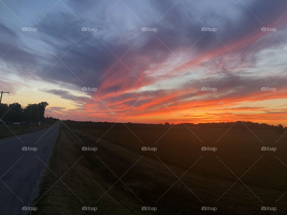 Vibrant Prairie Sunset overlooking country road