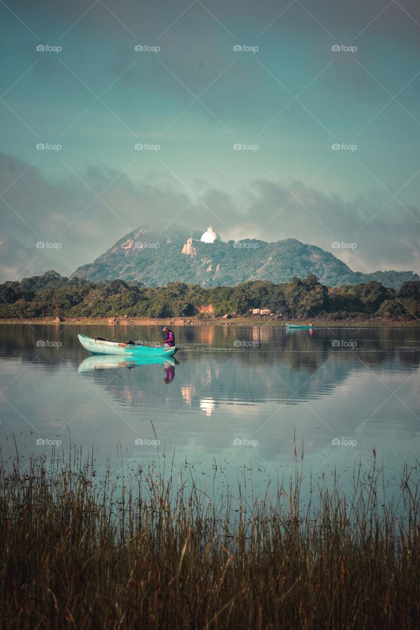 Beauty of the rural. A temple behind the lake, Mihintale Temple is rather a temple complex of ruins and shrines scattered over a fairly large mountain area connected by some 1840 steps that ultimately lead to the top. 