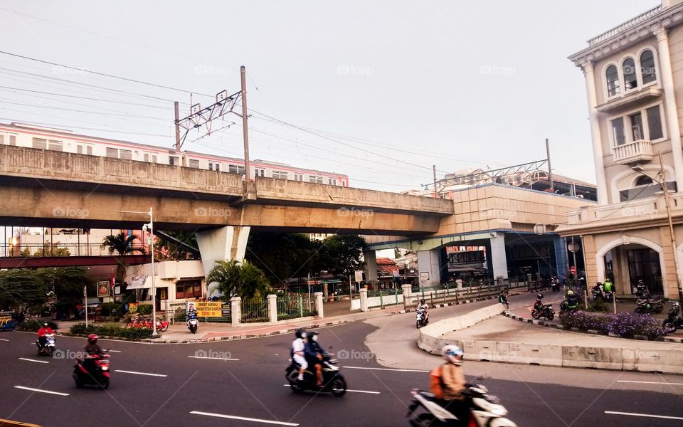 The train is passing in the morning taking the workers to the office